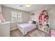 Bright bedroom with a twin bed, stuffed animals, and plenty of natural light at 75 Archer Glen Ave, Henderson, NV 89002