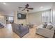 Spacious living room featuring tile floors, plantation shutters, and recessed lighting at 75 Archer Glen Ave, Henderson, NV 89002