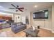 Open living room with tile flooring, natural light, and seamless flow to the backyard at 75 Archer Glen Ave, Henderson, NV 89002