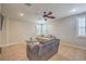 Comfortable living room with plush seating, neutral tones, and plantation shutters at 75 Archer Glen Ave, Henderson, NV 89002