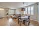 Open concept living space featuring hardwood flooring and a modern dining area at 75 Archer Glen Ave, Henderson, NV 89002