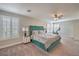 Main bedroom with plush bed, plantation shutters and ceiling fan at 75 Archer Glen Ave, Henderson, NV 89002