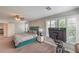 Bright main bedroom with a high ceiling and plantation shutters, including exercise equipment at 75 Archer Glen Ave, Henderson, NV 89002