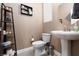 Bathroom with pedestal sink and tasteful decorations at 7630 Canyon Diablo Rd, Las Vegas, NV 89179