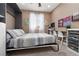 Bedroom with neutral tones, work space, and ample lighting at 7630 Canyon Diablo Rd, Las Vegas, NV 89179