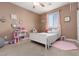 Bright bedroom featuring a white bed, a window and decorations on the wall at 7630 Canyon Diablo Rd, Las Vegas, NV 89179