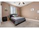 Bedroom featuring a full sized bed and neutral tones at 7630 Canyon Diablo Rd, Las Vegas, NV 89179