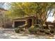 Beautiful home featuring manicured landscaping and a charming, covered front entryway at 7630 Canyon Diablo Rd, Las Vegas, NV 89179