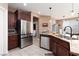 Modern kitchen with stainless steel appliances and granite countertops at 7630 Canyon Diablo Rd, Las Vegas, NV 89179