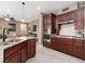 Kitchen featuring granite countertops, stainless steel appliances, and wooden cabinets at 7630 Canyon Diablo Rd, Las Vegas, NV 89179