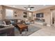Spacious living room filled with natural light, neutral paint and tile flooring at 7630 Canyon Diablo Rd, Las Vegas, NV 89179