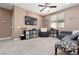 Upstairs living room featuring comfortable seating and entertainment center at 7630 Canyon Diablo Rd, Las Vegas, NV 89179