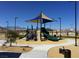 Modern community playground features climbing structures, slides, and sun shades for outdoor fun at 7630 Canyon Diablo Rd, Las Vegas, NV 89179