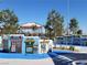 A charming themed playground featuring colorful storefront facades and playful designs under a sunny sky at 7630 Canyon Diablo Rd, Las Vegas, NV 89179