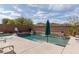 Pool with water features surrounded by desert landscaping at 7630 Canyon Diablo Rd, Las Vegas, NV 89179