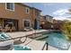 Relaxing pool with a waterfall feature and ample lounge space, ideal for enjoying sunny days outdoors at 7630 Canyon Diablo Rd, Las Vegas, NV 89179