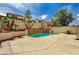 Backyard view highlighting the pool, patio, and privacy wall at 7637 Good Fortune Ct, Las Vegas, NV 89139