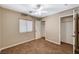 Neutral bedroom with carpet, a window, a closet, and access to ensuite bath at 7637 Good Fortune Ct, Las Vegas, NV 89139