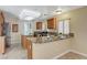 Updated kitchen showcasing granite counters, stainless appliances, and a cozy breakfast bar at 7637 Good Fortune Ct, Las Vegas, NV 89139