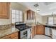 Well-equipped kitchen with stainless steel appliances, granite countertops, and ample cabinet space at 7637 Good Fortune Ct, Las Vegas, NV 89139