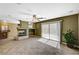 Open living area with fireplace, tile floors, and sliding door to pool at 7637 Good Fortune Ct, Las Vegas, NV 89139