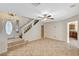 Spacious living room with tile flooring, staircase, and neutral paint at 7637 Good Fortune Ct, Las Vegas, NV 89139