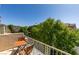 Charming balcony with outdoor seating, offering a great place to relax and enjoy the view or a morning coffee at 7645 Interlace St, Las Vegas, NV 89149