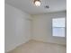 Minimal bedroom with a sliding door closet and window, offering ample space and natural light at 7645 Interlace St, Las Vegas, NV 89149