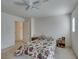 This carpeted bedroom features an ensuite door, offering natural light from the windows at 7645 Interlace St, Las Vegas, NV 89149