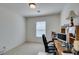 This simple bedroom has a small window, a desk and a chair at 7645 Interlace St, Las Vegas, NV 89149