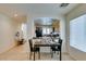 Bright dining area with a table, and an open view into the adjacent kitchen, creating an inviting and functional space at 7645 Interlace St, Las Vegas, NV 89149