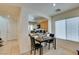 Open dining area with modern chairs and natural light, flowing to a kitchen at 7645 Interlace St, Las Vegas, NV 89149