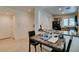 Bright dining area with a table that leads to a kitchen offering great flow and connectivity within the home at 7645 Interlace St, Las Vegas, NV 89149