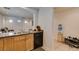 Well-maintained kitchen with stainless steel sink, faucet, and black appliances, offering a functional and stylish cooking space at 7645 Interlace St, Las Vegas, NV 89149