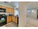 Functional kitchen with tile floors and black appliances at 7645 Interlace St, Las Vegas, NV 89149