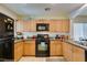 Well-equipped kitchen with light wood cabinets and appliances, perfect for cooking and entertaining with countertop views at 7645 Interlace St, Las Vegas, NV 89149