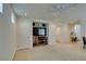 Bright, carpeted living room with recessed lighting, adjacent to a kitchen and dining area at 7645 Interlace St, Las Vegas, NV 89149
