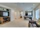 Spacious living room flows into an open-concept kitchen and dining area with bright, natural light at 7645 Interlace St, Las Vegas, NV 89149
