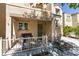 Inviting covered porch with space for seating and a grill at 7645 Interlace St, Las Vegas, NV 89149
