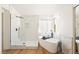 Elegant bathroom with a freestanding tub, glass shower, and marble accents creates a spa-like experience at 7825 Desert Bell Ave, Las Vegas, NV 89128