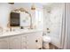 Charming bathroom with a double vanity, gold accents, and shower/tub combo offers a touch of elegance at 7825 Desert Bell Ave, Las Vegas, NV 89128