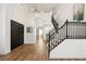 Bright foyer with a staircase and wood floors, providing a welcoming entrance at 7825 Desert Bell Ave, Las Vegas, NV 89128