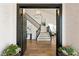 Elegant foyer with hardwood floors and a view of the staircase at 7825 Desert Bell Ave, Las Vegas, NV 89128