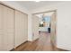 Inviting hallway leads to a bright bedroom with a stylish chandelier and plenty of natural light at 7825 Desert Bell Ave, Las Vegas, NV 89128