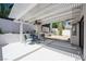 Inviting outdoor patio with a ceiling fan, comfortable seating, and desert landscaping at 7825 Desert Bell Ave, Las Vegas, NV 89128