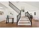 Stylish staircase with dark railings and modern decor at 7825 Desert Bell Ave, Las Vegas, NV 89128