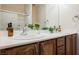 Bathroom with dual sinks, vanity with drawers, and modern faucets at 7957 Fantail Dr, North Las Vegas, NV 89084