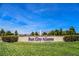 Beautifully landscaped sign for Sun City Aliante with a fountain and clear blue sky at 7957 Fantail Dr, North Las Vegas, NV 89084