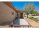 A cozy front porch features a gated entrance and an inviting entryway at 7957 Fantail Dr, North Las Vegas, NV 89084