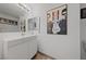 Modern bathroom featuring sleek vanity, contemporary lighting and framed wall art at 823 Schooner Dr, Henderson, NV 89015